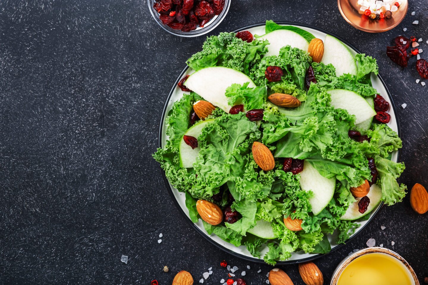 kale salad with dried cranberry apples almonds