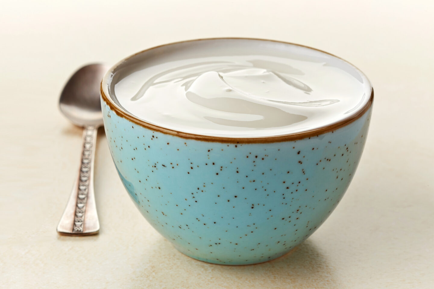 plain greek yogurt in blue bowl