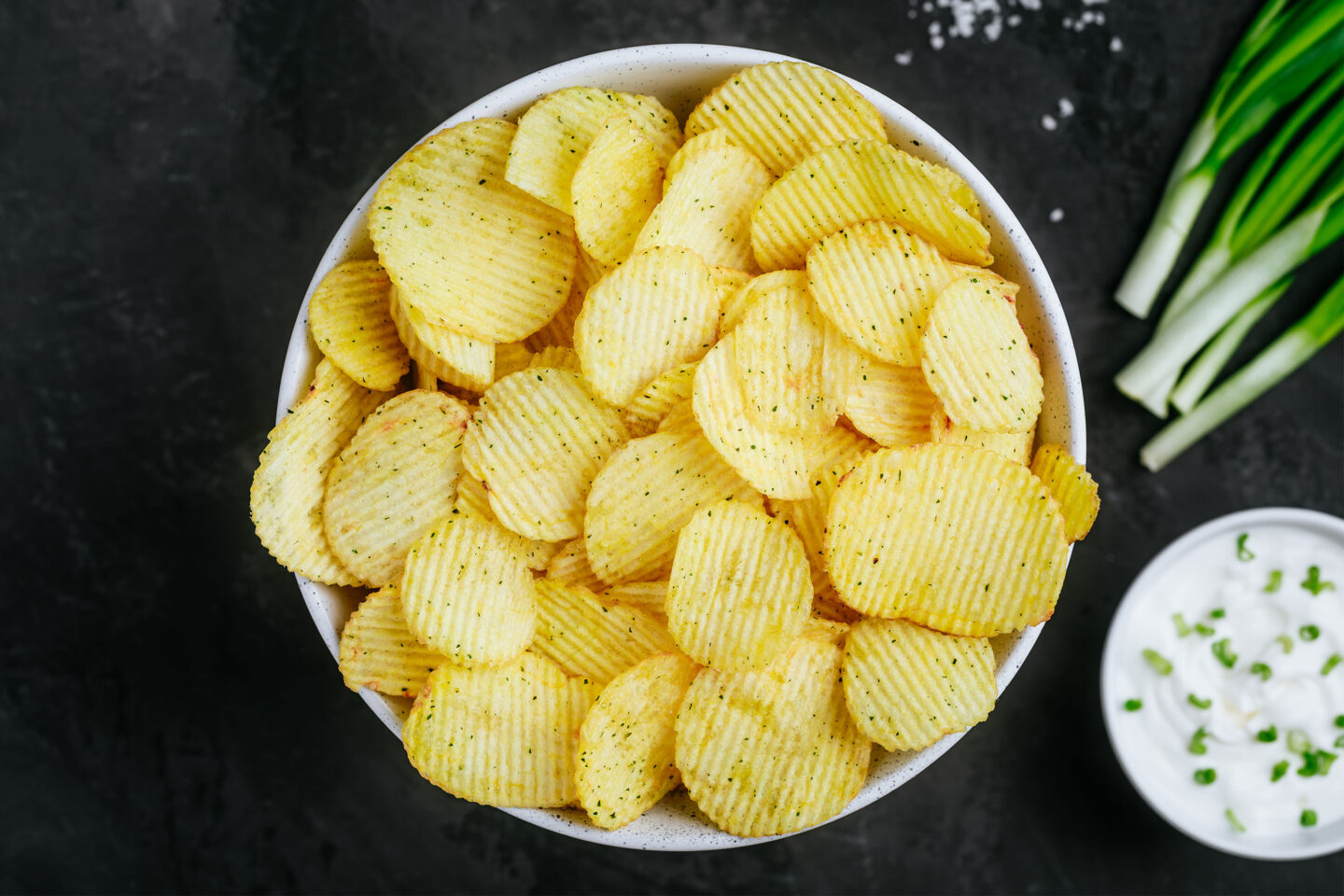 crispy potato chips and sour cream with onion