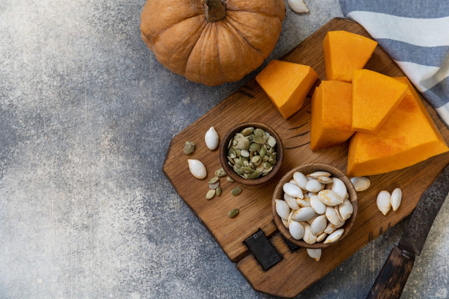 pumpkin seeds in wooden bowl