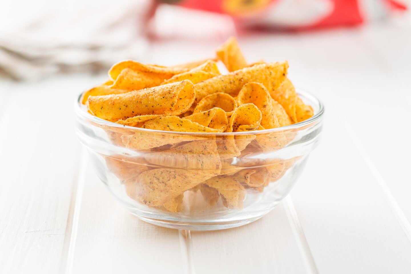 rolled tortilla chips in glass bowl