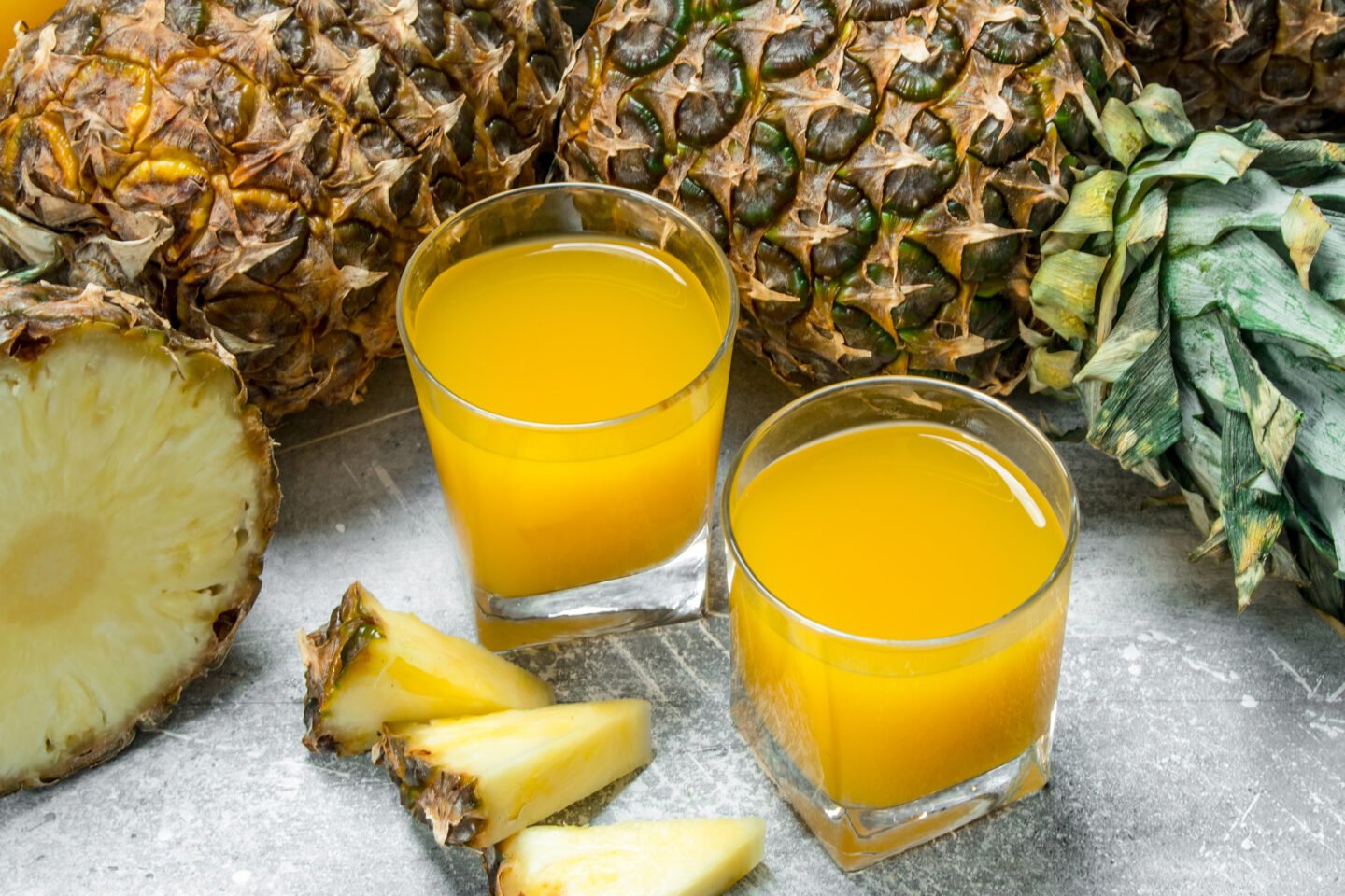 fresh pineapple juice and ripe pineapples