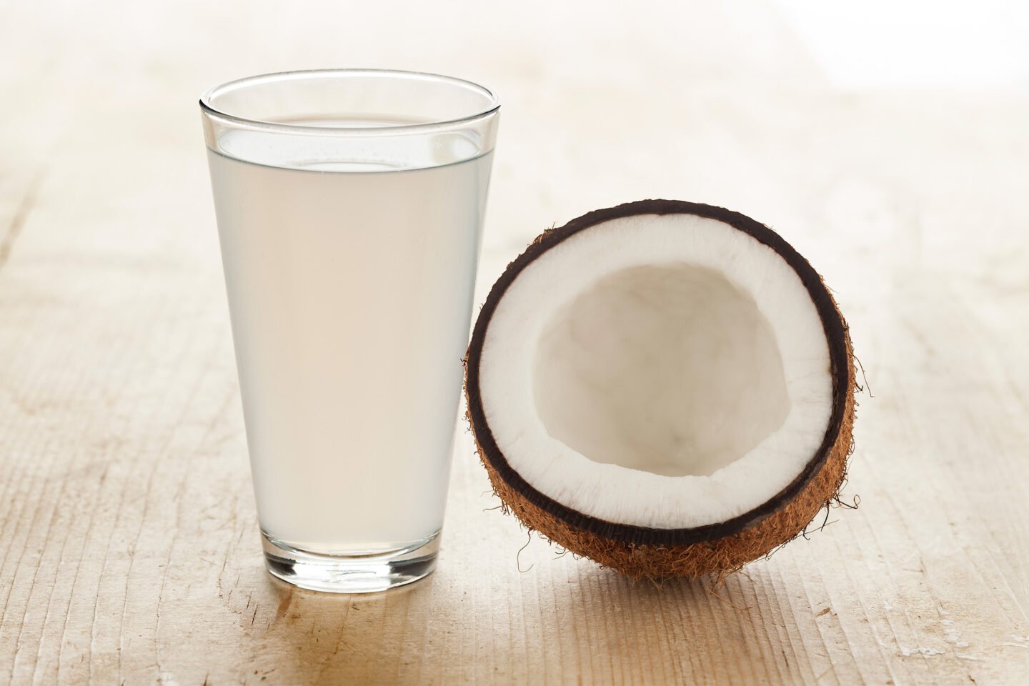 half coconut with a glass of coconut water