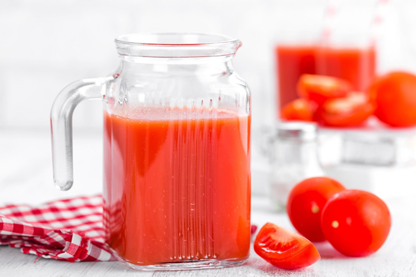 tomato juice in pitcher and glass