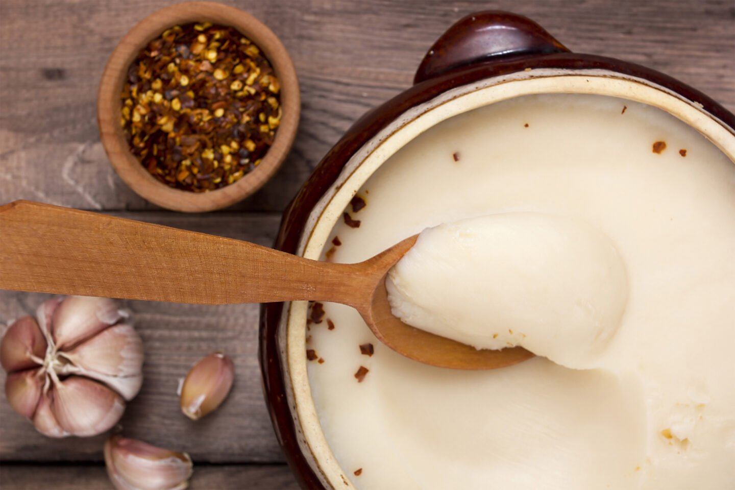 lard in a wooden bowl with spoon