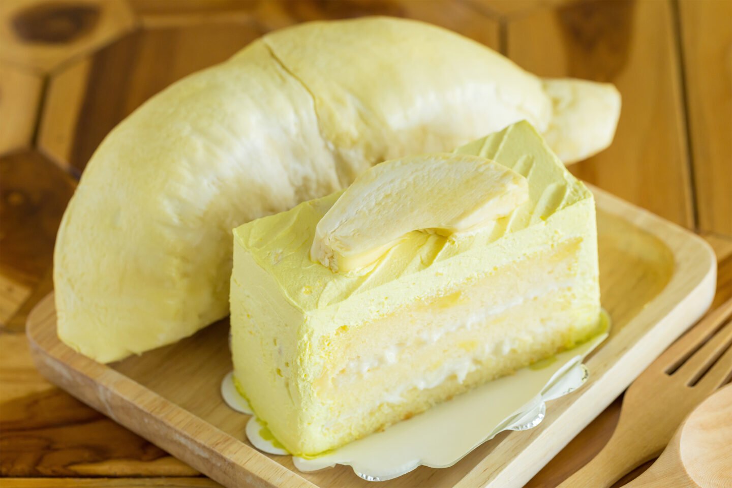 slice of durian cake with fresh durian flesh