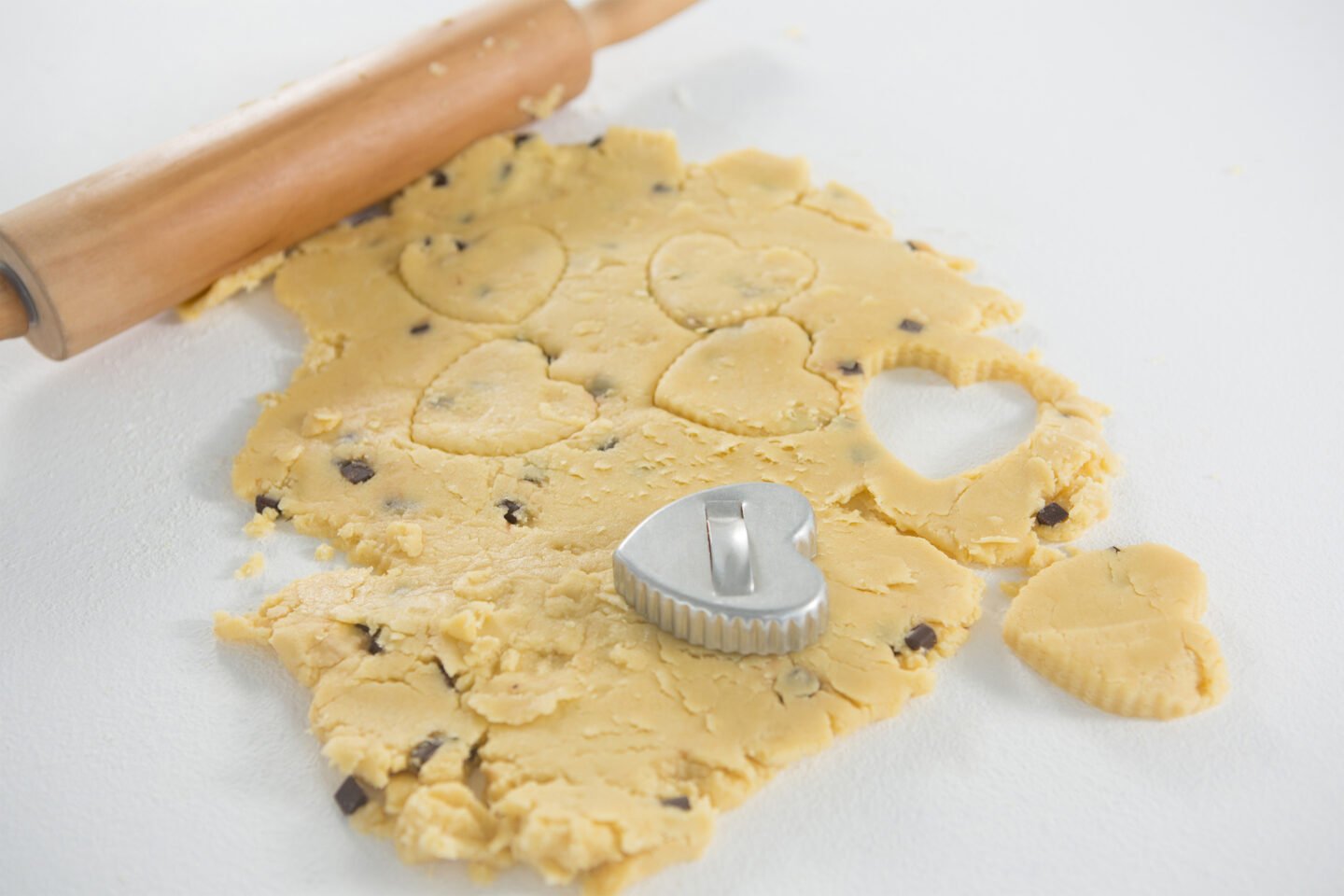 rolling pin and cookie cutter on cookie dough