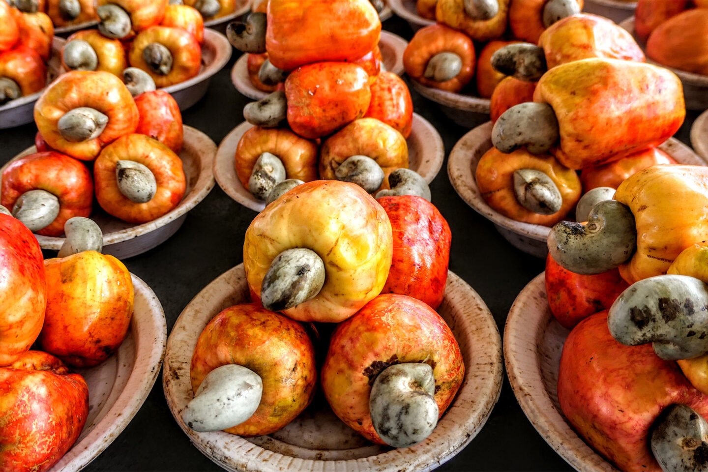 colorful cashew fruits in a market