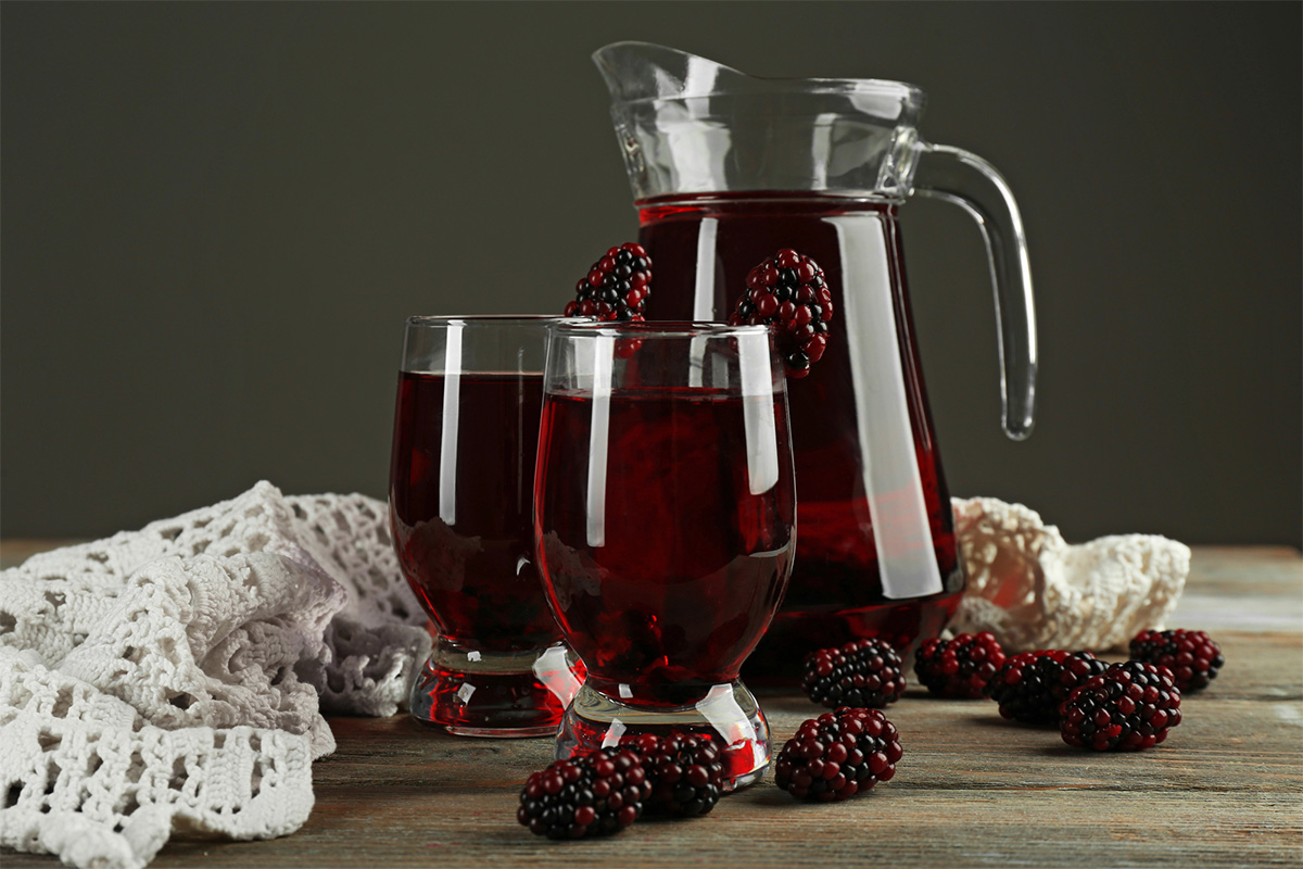 pitcher and glasses of blackberry juice