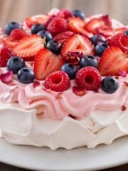 pavlova made with rose cream and summer berries